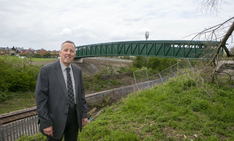 NEW BRIDGE: Coun Robert Frost with the new structure. Picture: Shaun Colborn. PD092121