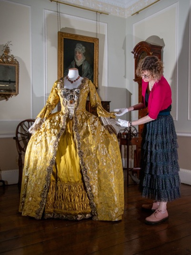 Curator Melissa Gallimore with one of the costumes loaned to Cannon Hall Museum. PD093184