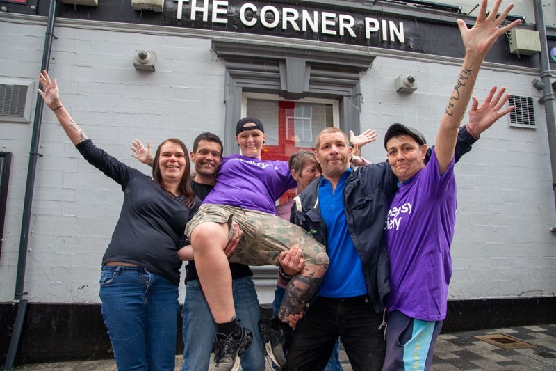 SKY DIVING: Landlady Jyneen Haughie with some of her regulars who are supporting her when she goes sky diving in memory of her sister> Picture Shaun Colborn PD093175