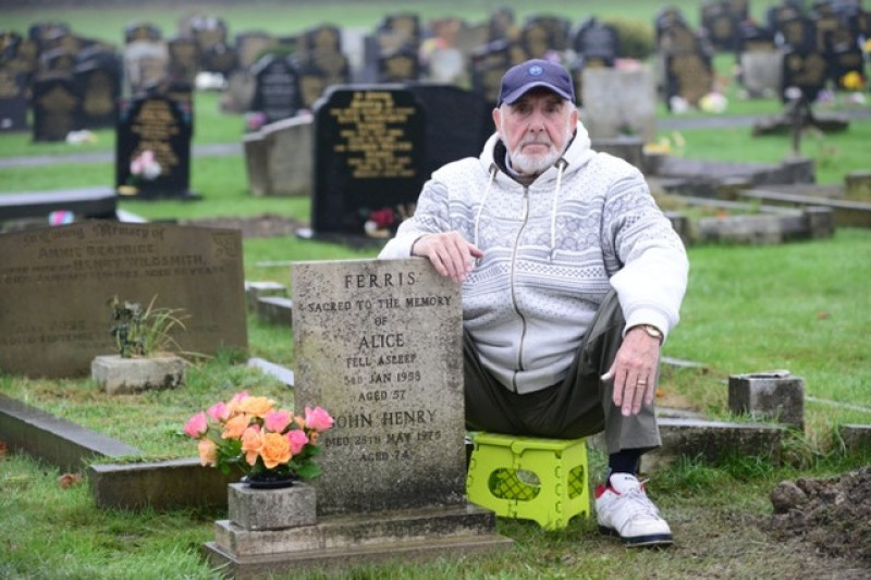 Main image for Family devastated as grave is covered in soil