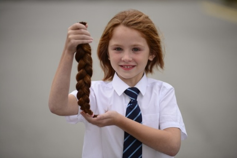 Main image for Hannah chops luscious locks for charity