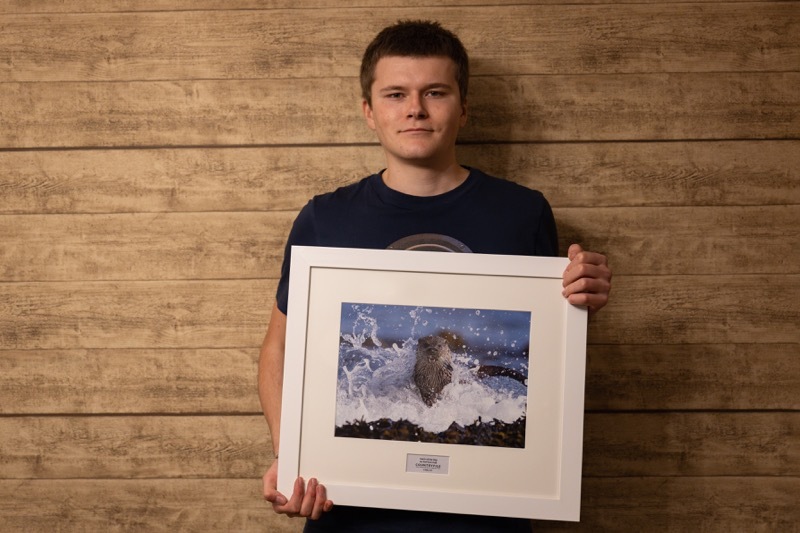 Harrison Hall with his calendar photo.