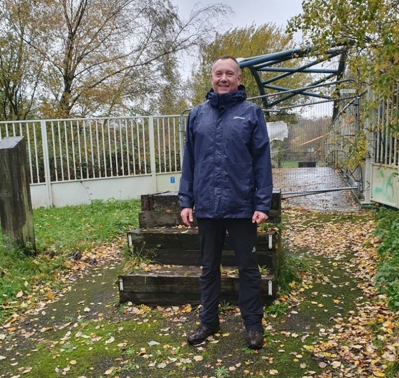 DELIGHT: Coun David Greenhough at the long-closed bridge.