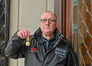 Graham Burton with the medal.