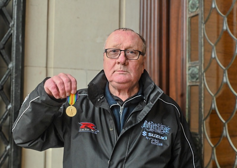 Graham Burton with the medal.