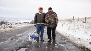 REPAIR REQUIRED: Mick Drewry and Paul Birch-Garth on the pothole-strewn road. Picture: Scott Firth.