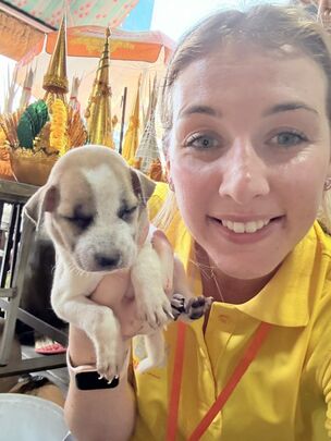 MISSION: Robyn with one of the many dogs she’s helped vaccinate in Cambodia.