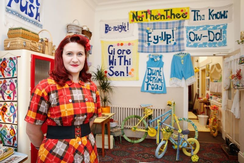 Main image for Gemma behind village’s Tour welcome