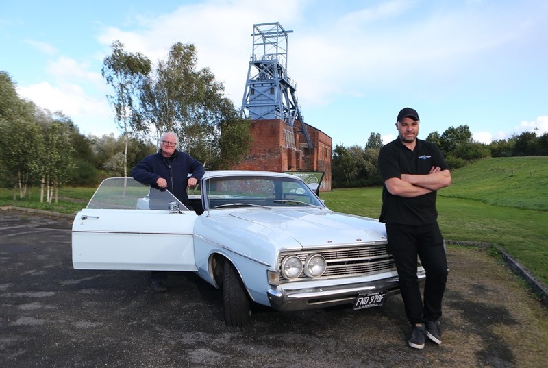 Main image for TV crew motor into town...
