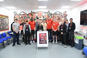 WEAR IT RED: Barnsley College students with Barnsley FC u21 players.