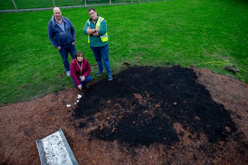 Coun Leech, Tattersall and Wright survey the damage done to a children’s play area just hours after installation. Picture Shaun Colborn PD094561