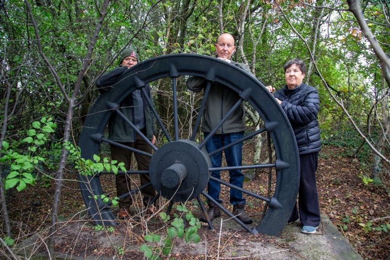 PIT WHEEL: The hidden Birdwell pit wheel, Coun Andy Wray would like to see it re-sited. He is pictured with Keith and Val Taylor.