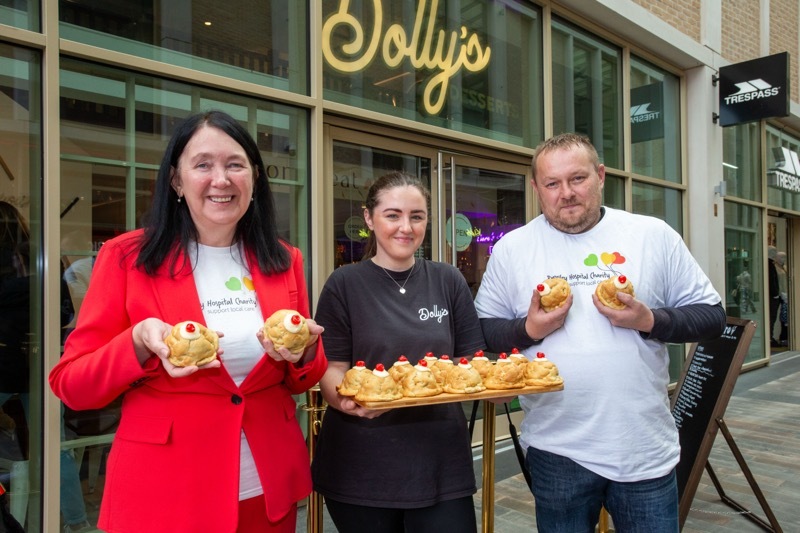 Charity Buns: Hospital charity fund raiser Jane Mills and volunteer Matt Simmons along with Georga Oxley. Picture Shaun Colborn PD094522