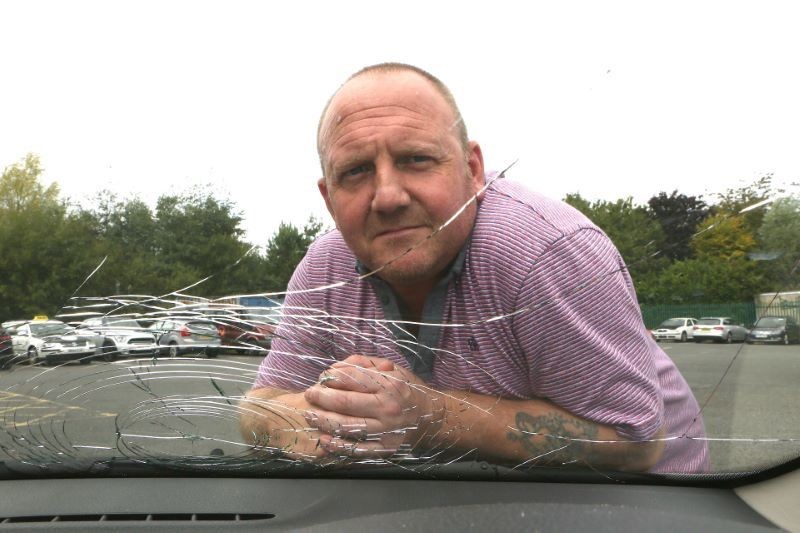 Main image for Taxi driver has lucky escape after windscreen smashed