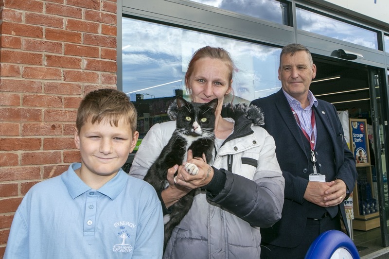 What’s news pussycat: the three legged furry feline, who customers find irresistible, outside the Darfield branch of Tesco with owner Jessica Moore. Picture Shaun Colborn PD092513