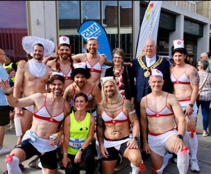 ON THE RUN: Ryan Hinchliffe and his team of friends with the Mayor Coun David Leech.