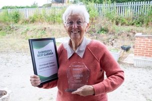 Community Garden: Wombwell’s line side garden has walked away with the Barnsley’s best community garden award in a competition organised by the Barnsley Chronicle, pictured receiving the award on behalf of the group is Eileen Parry.