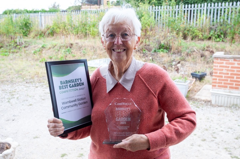 Community Garden: Wombwell’s line side garden has walked away with the Barnsley’s best community garden award in a competition organised by the Barnsley Chronicle, pictured receiving the award on behalf of the group is Eileen Parry.